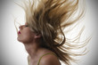 © grufnar - woman with hair flying in the air