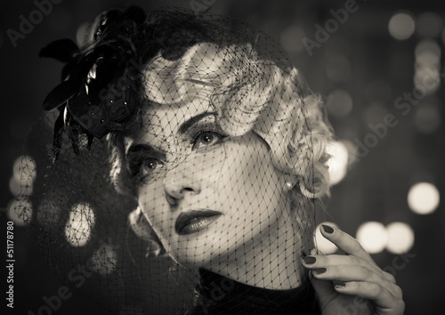 Fototapeta na wymiar Monochrome picture of elegant blond retro woman