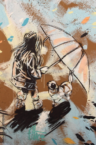 Fototapeta na wymiar graffiti on Rome's public wall girl with umbrella and dog