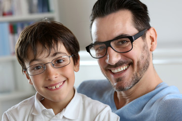 Portrait of young boy with daddy with eyeglasses on