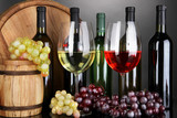 Fototapeta Panele - Assortment of wine in glasses and bottles on grey background