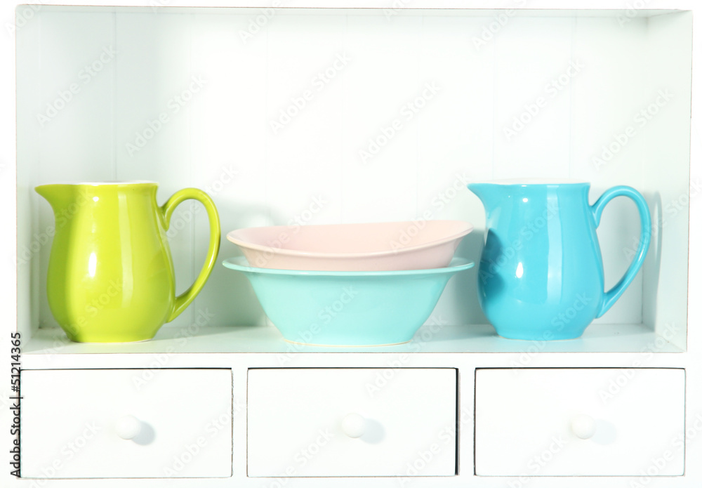 Kitchen utensils on beautiful white shelves
