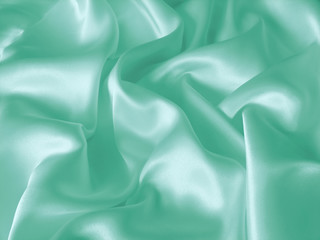 Draped turquoise silk background