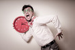 © Eugenio Marongiu - funny businessman with wall clock