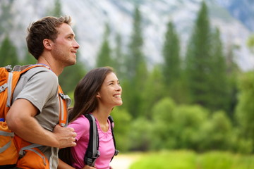 couple - active hikers hiking in yosemite