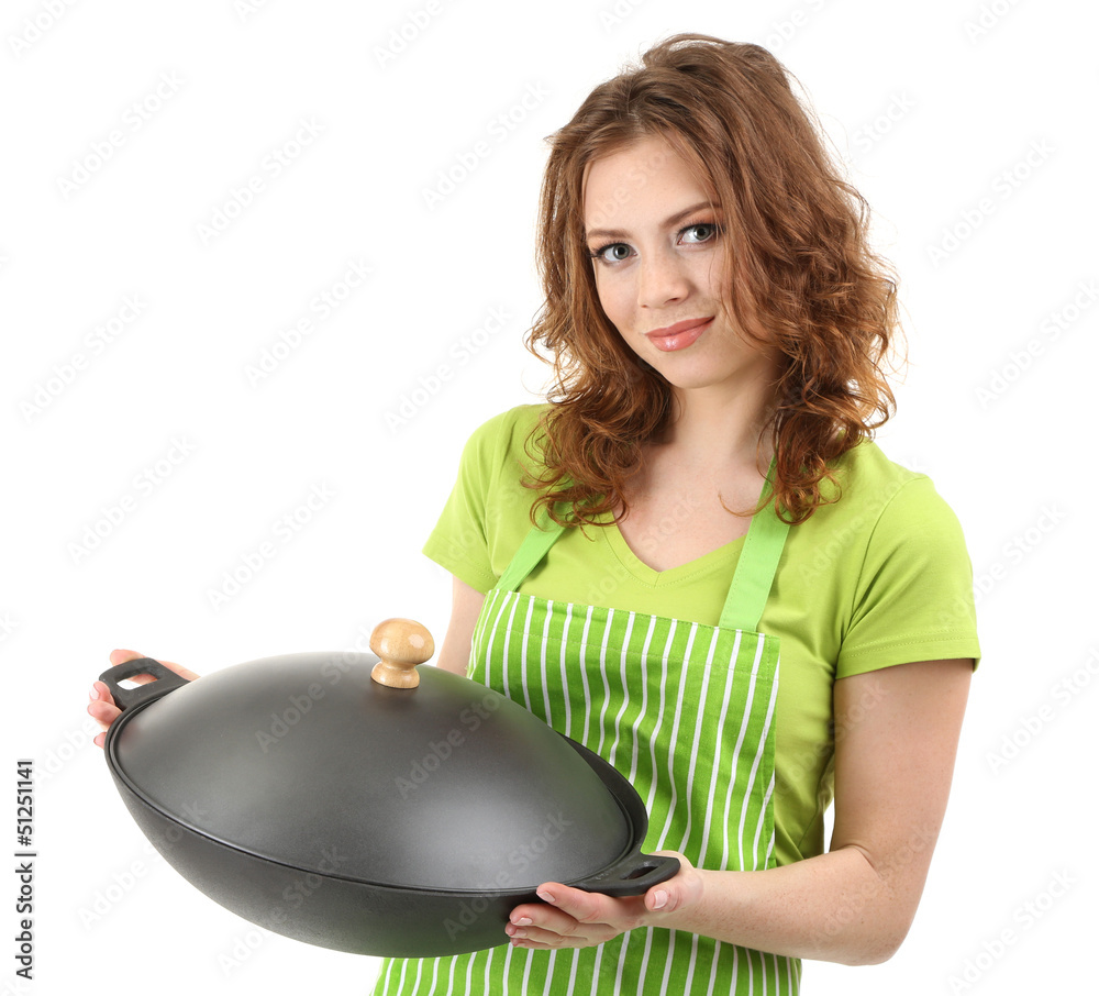 Young woman wearing kitchen apron with wok pan, isolated
