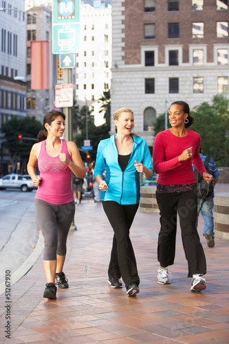 Fotografía Group Of Women Power Walking On Urban Street