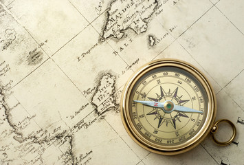 old compass on vintage map 1732