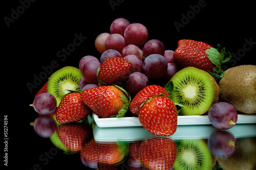 Naklejka na szybę still life of fresh fruit on a black background