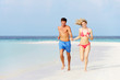 © Monkey Business - Romantic Couple Running On Beautiful Tropical Beach