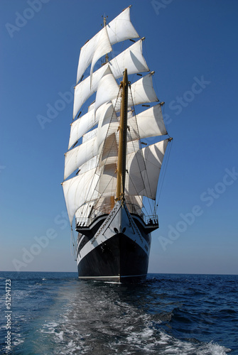 Fototapeta na wymiar Sailing frigate under full sail in the ocean