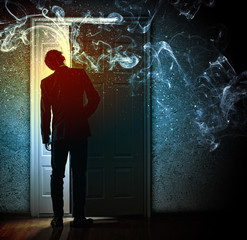 Wall Mural - Young businessman opening door