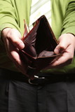 Fototapeta  - Empty wallet in male hands - poor economy