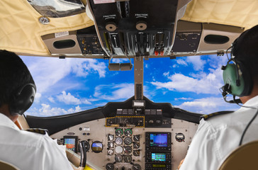 Pilots in the plane cockpit and sky