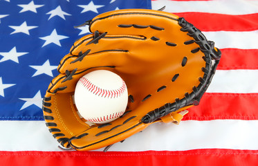 Baseball glove and ball on American flag background