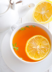 Canvas Print - Fresh tea with lemon in the white cup