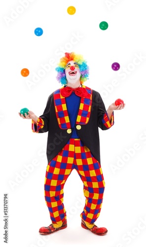 Fotografía Juggler clown throwing colorful balls