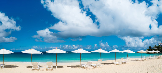  Chairs and umbrellas on tropical beach