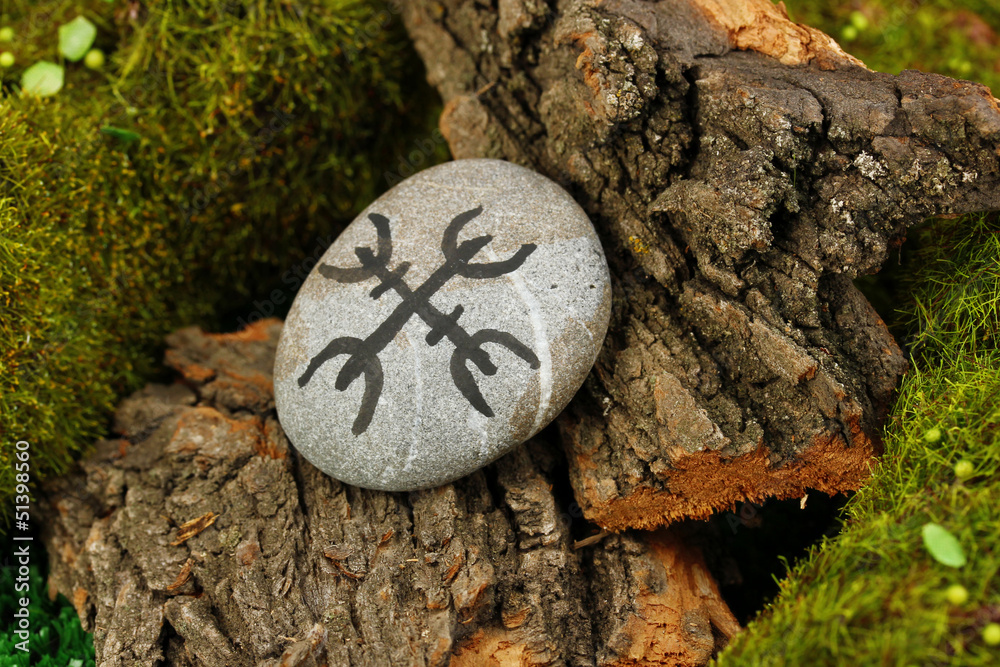 Fortune telling  with symbols on stone close up