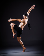 Naklejka na meble Dancer dancing in the dark studio