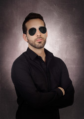 Wall Mural - Young bearded businessman with sunglasses