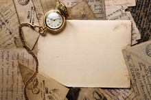 Vintage Pocket Clock On Old Letters Texture