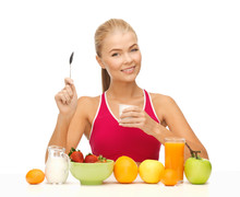 Young Woman Eating Healthy Breakfast
