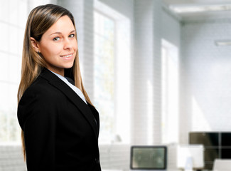 Wall Mural - Beautiful businesswoman in her office