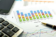 © chochowy - Financial paper charts and graphs with iphone and calculator