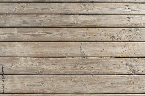 Fotografía Weathered Wooden Boardwalk on Sand