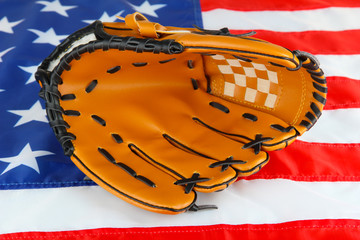 Wall Mural - Baseball glove on American flag background