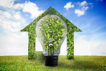Poster - Big light bulb in front of house