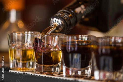 Naklejka na meble Shots with whisky and liqquor in cocktail bar