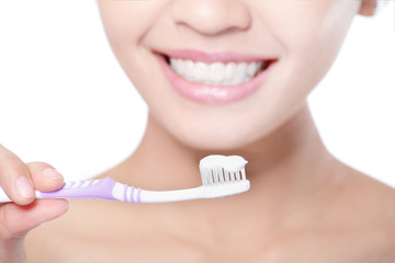 Canvas Print - smiling woman cleaning teeth with toothbrush