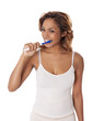 Beautiful young woman brushing her teeth.