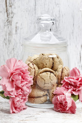 Poster - Parisian macarons among pink carnation flowers