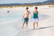 © william87 - Young Couple Walking on Caribbean Beach