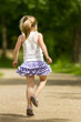 Young girl skipping away