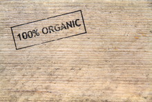 " 100% Natural " Stamped Text On Old Plank