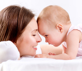 Fototapete - Mother and Baby kissing and hugging. Happy Family