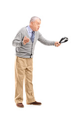 Poster - Full length portrait of an angry mature man holding a belt and t