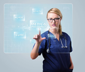 Young nurse pressing modern medical type of buttons