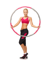 Young Sporty Woman With Hula Hoop