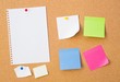© Proxima Studio - Colour note papers on pin board. Cork background