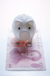 piggy bank on china dollar banknote