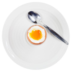 soft boiled egg in egg cup on white plate