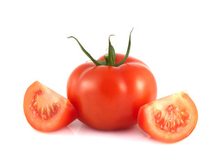 Isolated red tomato with two slices on a white