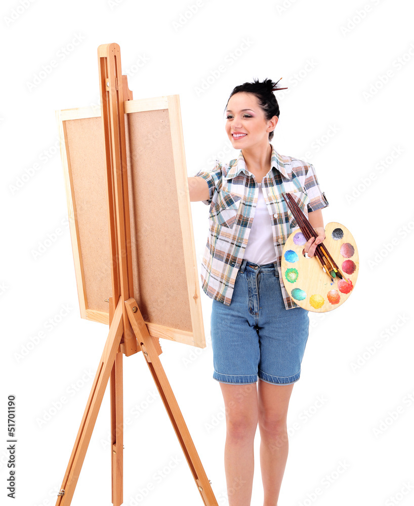 Beautiful young woman painter at work, isolated on white