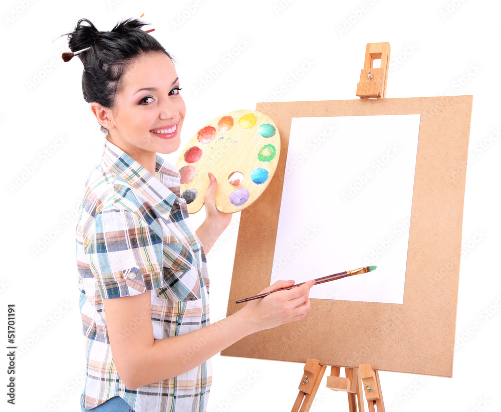 Beautiful young woman painter at work, isolated on white