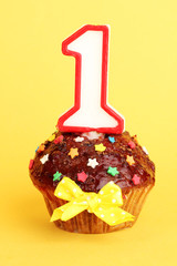 Poster - Birthday cupcake with chocolate frosting on background